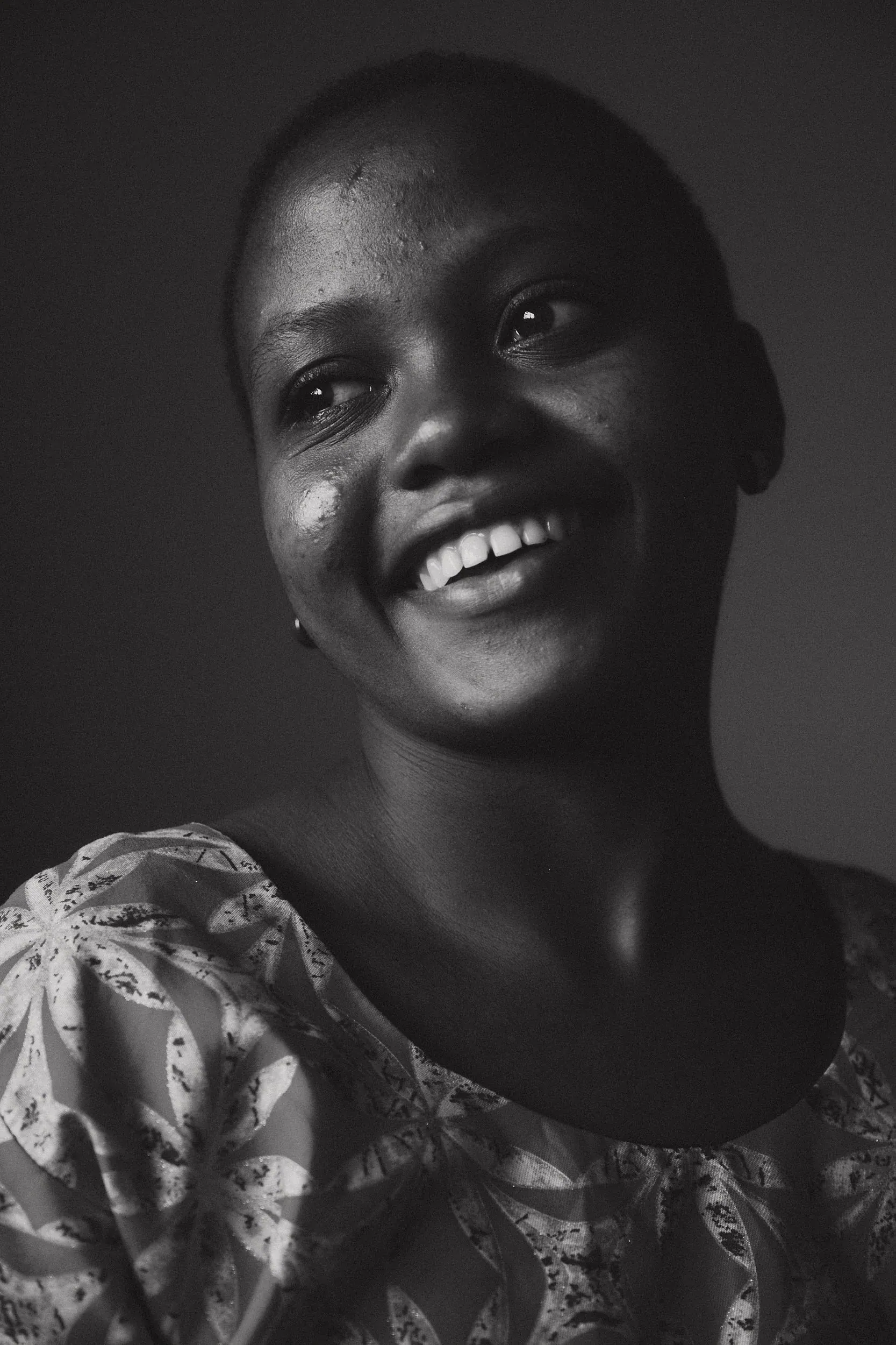 Portrait of a young woman smiling (black and white)