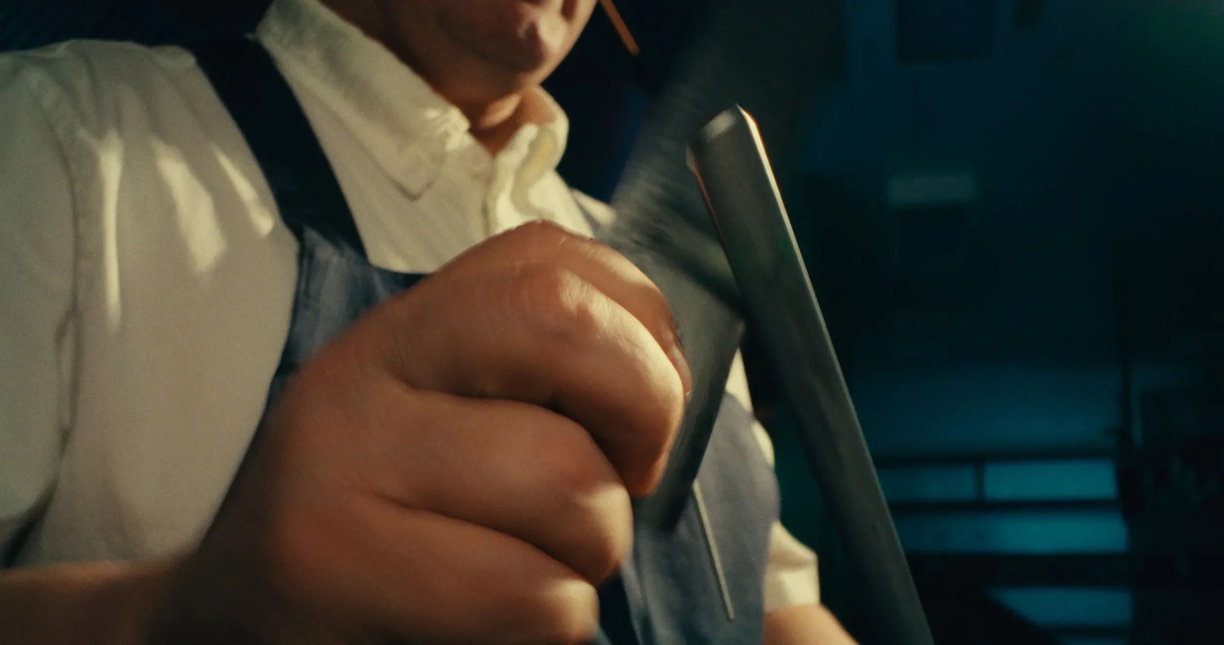 A chef sharpens a knife on a steel